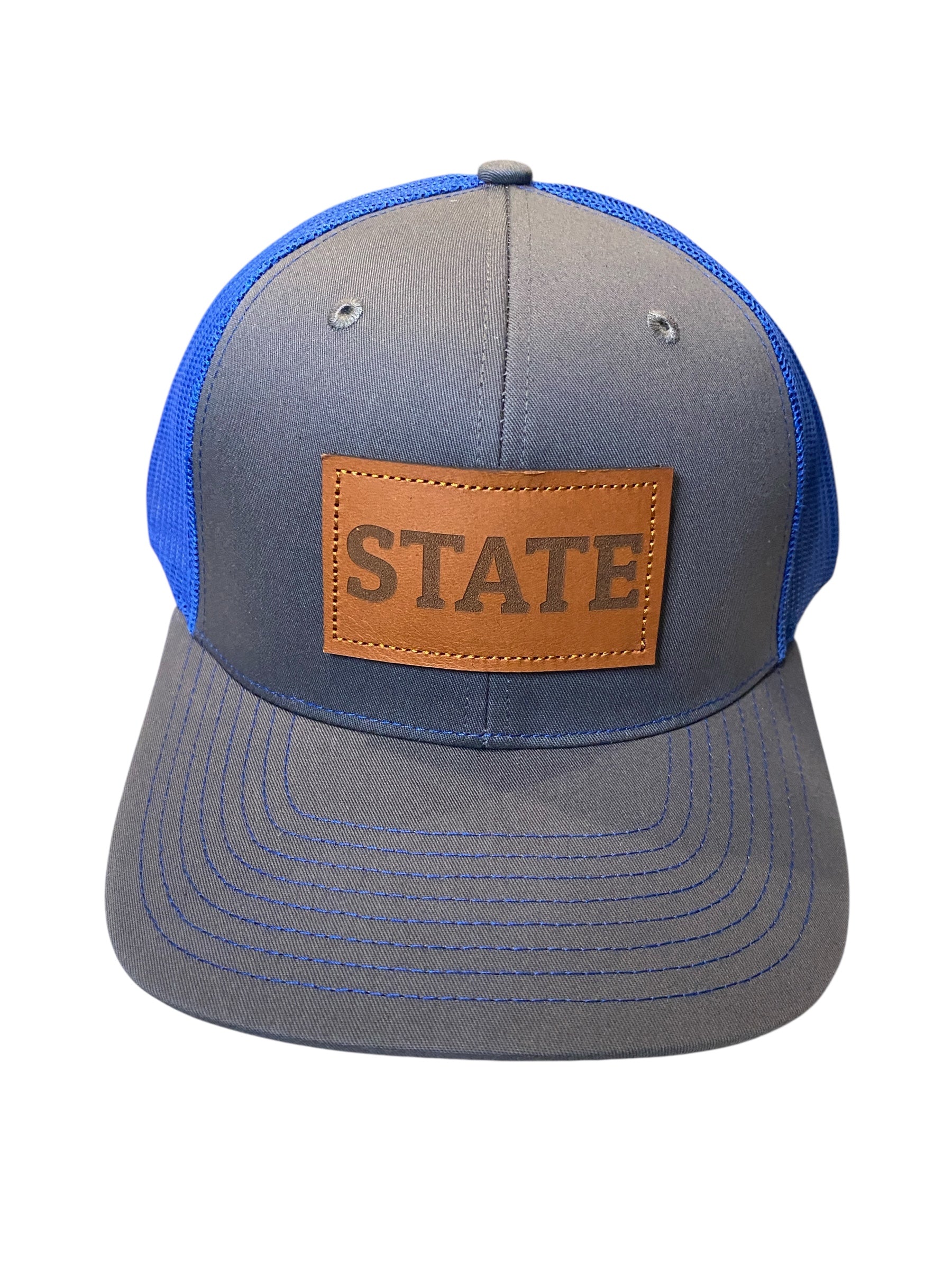 Leather patch STATE Trucker Hat in charcoal/royal blue mesh
