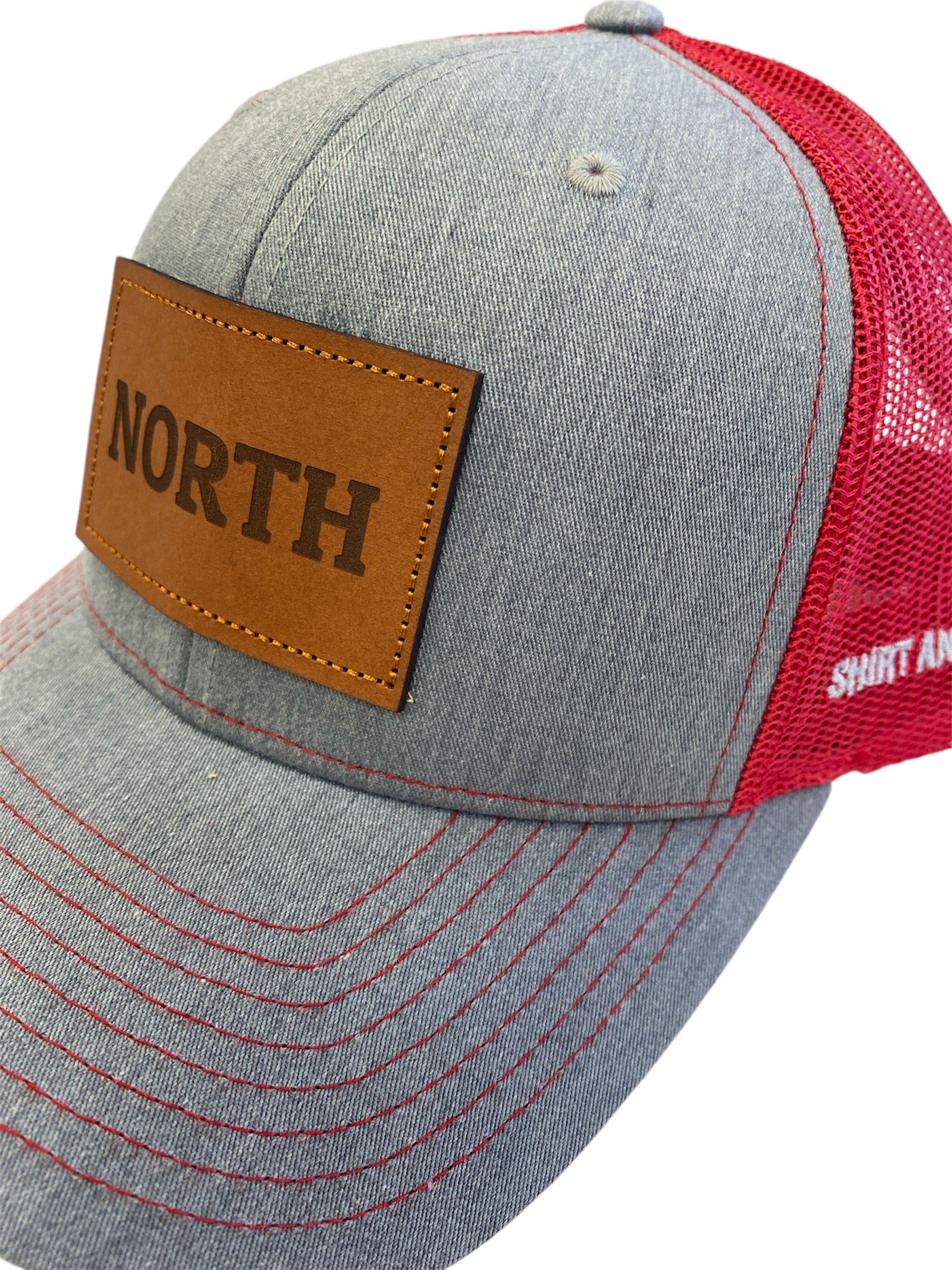 Leather Patch NORTH Trucker Hat in heather gray/red mesh