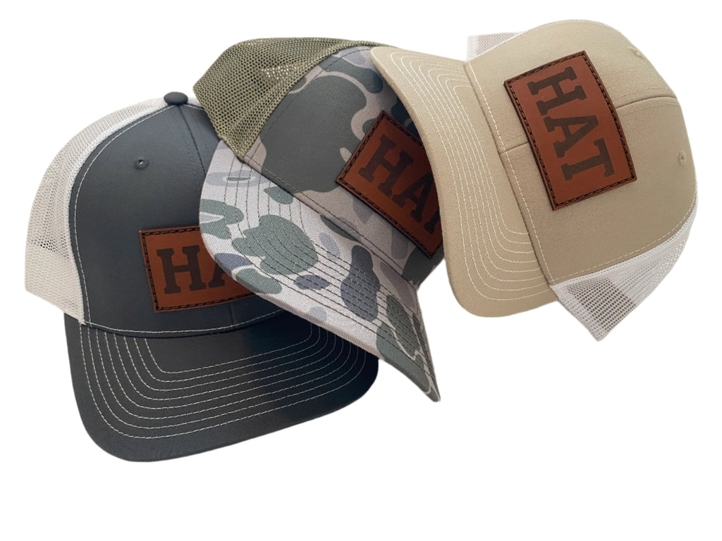 stack of three hats