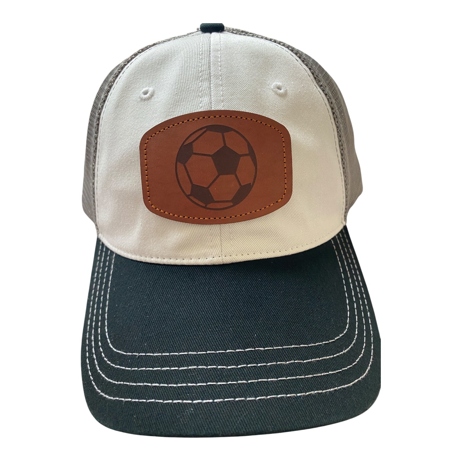 Unstructured leather patch soccer ball trucker hat in black/white/gray mesh